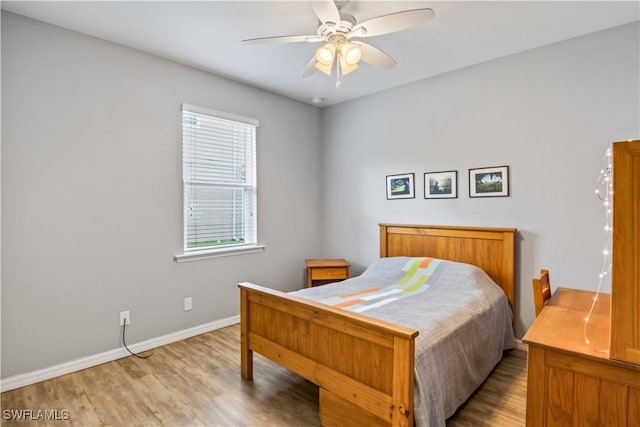 bedroom featuring ceiling fan and light wood-type flooring