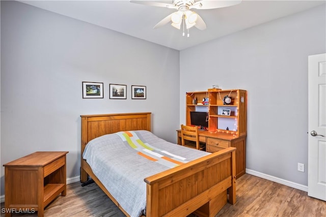 bedroom featuring hardwood / wood-style floors and ceiling fan