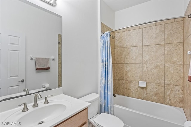 full bathroom with vanity, shower / bath combo, and toilet