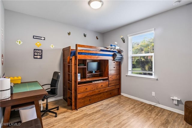 bedroom with light hardwood / wood-style floors