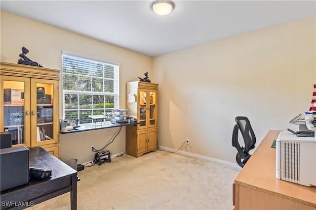 carpeted office space featuring french doors