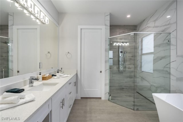 bathroom featuring vanity and plus walk in shower