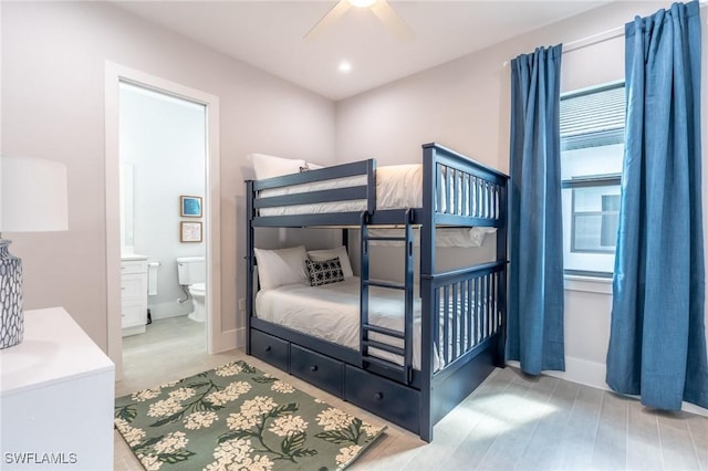 bedroom with ceiling fan and ensuite bathroom