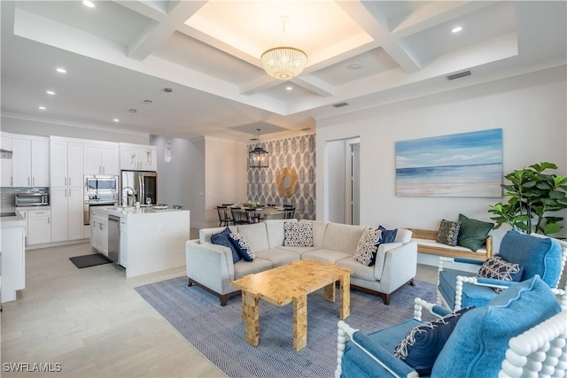 living room featuring coffered ceiling, beam ceiling, and a chandelier