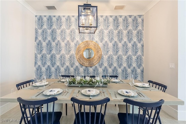 dining room featuring an inviting chandelier and crown molding