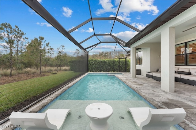 view of swimming pool featuring an outdoor living space, a lanai, a patio area, and a lawn