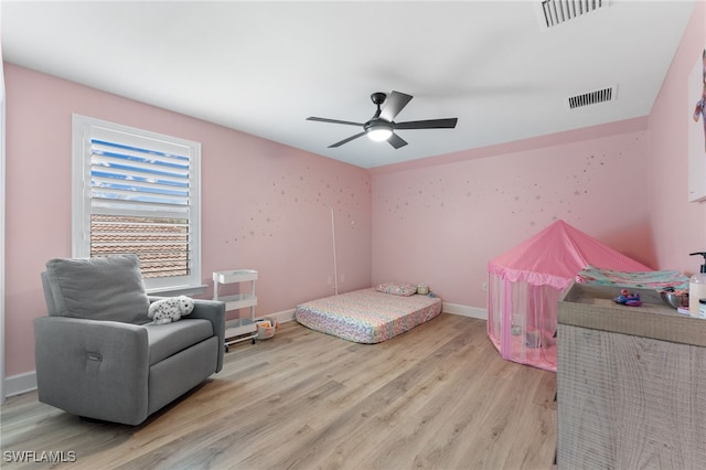 bedroom featuring ceiling fan and light hardwood / wood-style flooring