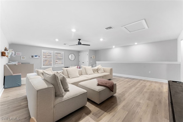 home theater featuring ceiling fan and light wood-type flooring