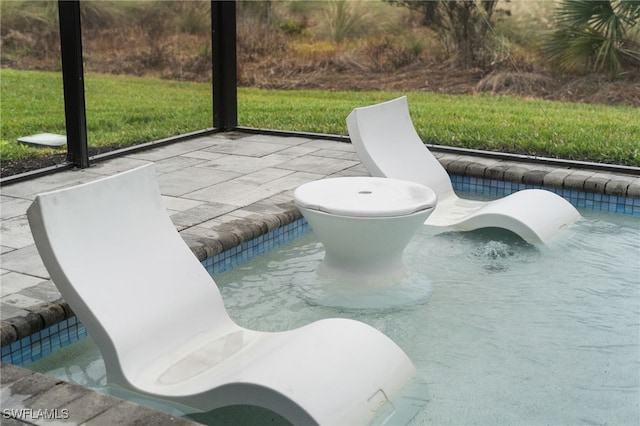 view of swimming pool featuring a patio area