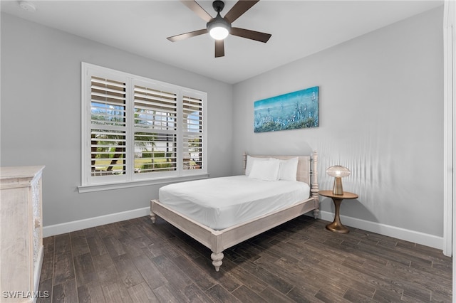 bedroom with dark wood-type flooring and ceiling fan