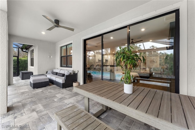 view of patio with an outdoor hangout area and ceiling fan