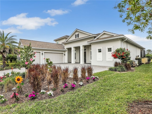 view of front of house with a garage and a front lawn