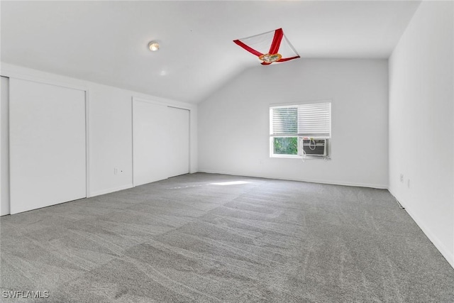 bonus room with carpet floors, cooling unit, and vaulted ceiling