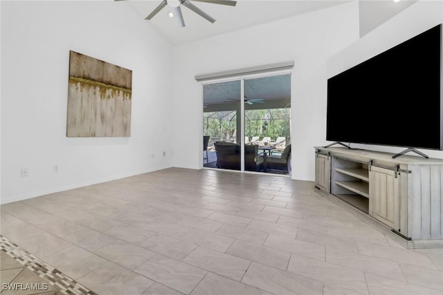 unfurnished living room featuring light tile patterned floors, vaulted ceiling, and ceiling fan