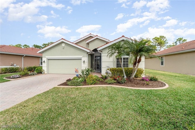 view of front of property with a garage and a front yard