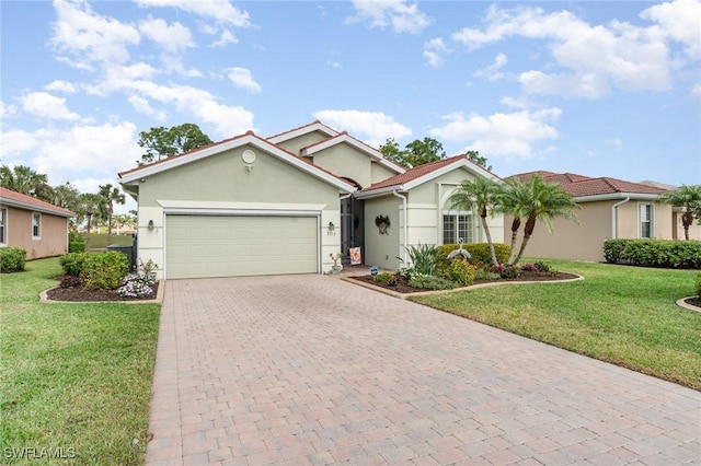 view of front of home with a garage and a front yard