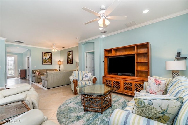 living room with crown molding, light tile patterned floors, and ceiling fan