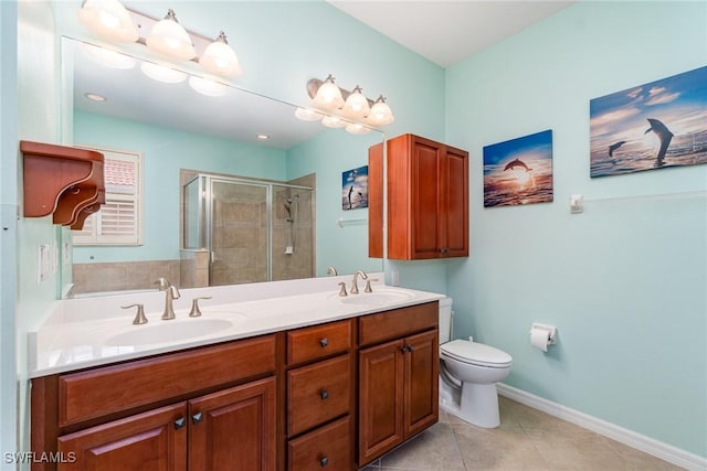 bathroom featuring walk in shower, vanity, toilet, and tile patterned flooring