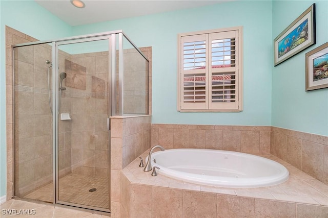 bathroom with tile patterned flooring and separate shower and tub