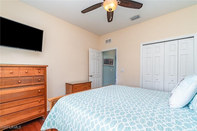 bedroom with hardwood / wood-style flooring, a closet, and ceiling fan