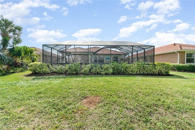 view of yard with glass enclosure