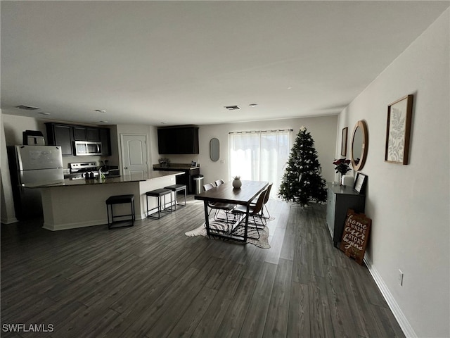 dining room with dark wood-type flooring