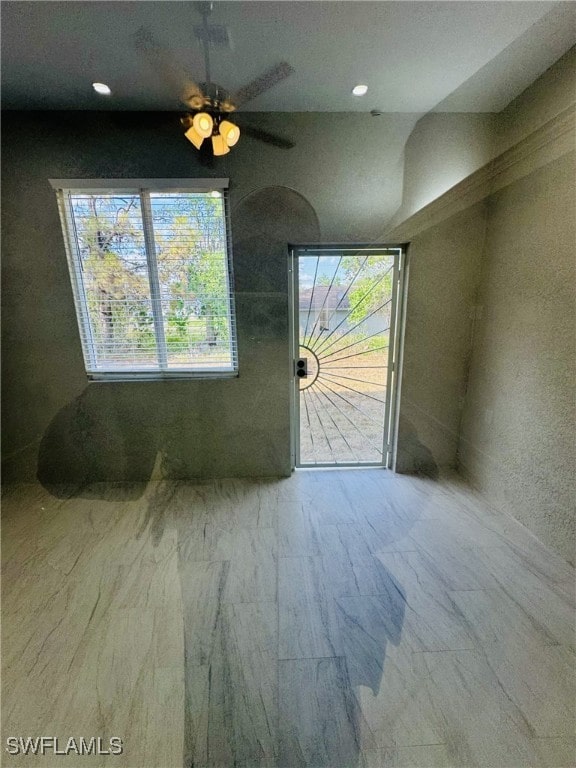 interior space with recessed lighting and marble finish floor