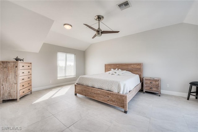 bedroom featuring baseboards, visible vents, vaulted ceiling, and light tile patterned flooring