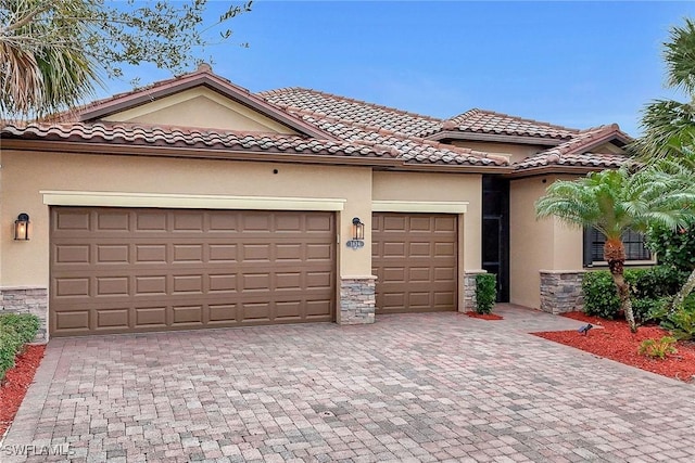 view of front of home with a garage