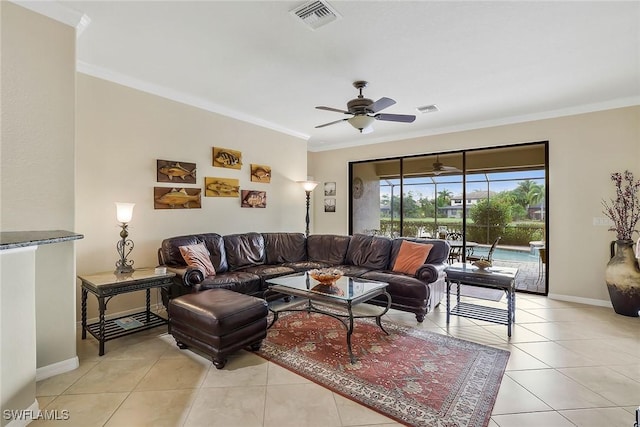 tiled living room with crown molding and ceiling fan