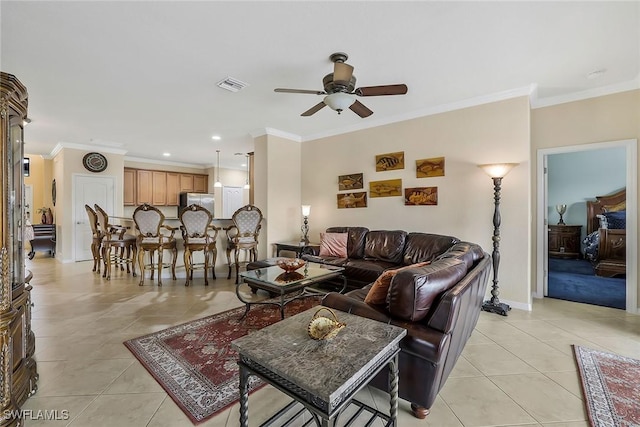 tiled living room with crown molding and ceiling fan