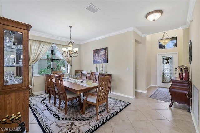 dining room featuring light tile patterned flooring, crown molding, and a chandelier