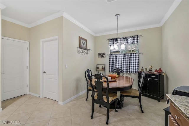 tiled dining room featuring crown molding and a chandelier