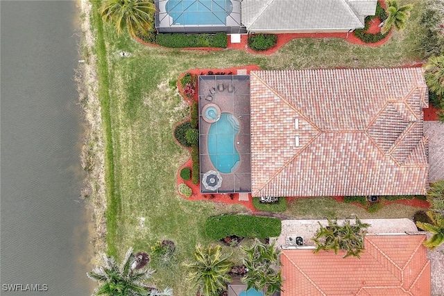 birds eye view of property featuring a water view