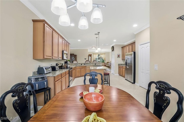 dining space with ornamental molding