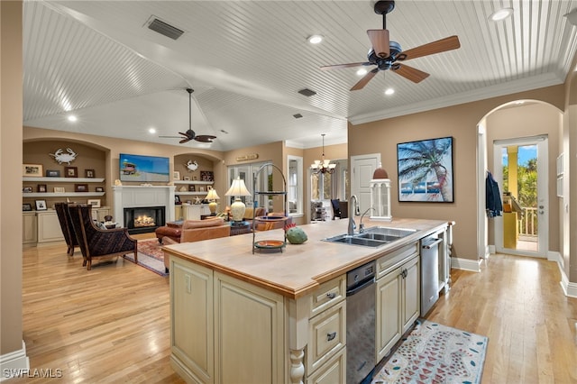 kitchen featuring a kitchen island with sink, built in features, light hardwood / wood-style floors, and wooden ceiling