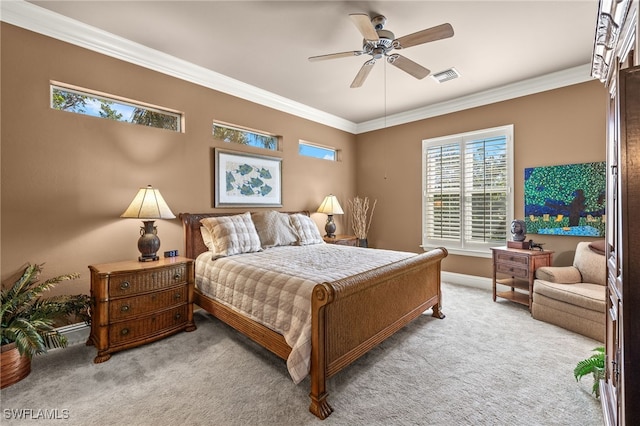 carpeted bedroom featuring ornamental molding and ceiling fan