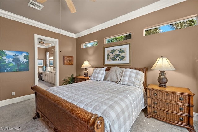 carpeted bedroom featuring ornamental molding, connected bathroom, and ceiling fan