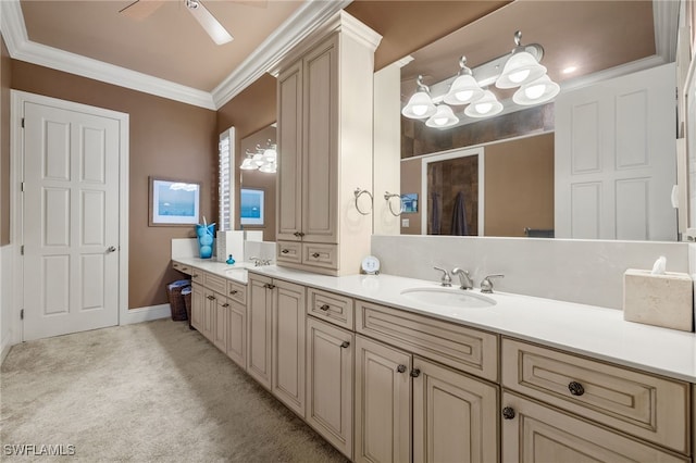 bathroom featuring a shower with door, crown molding, vanity, and ceiling fan