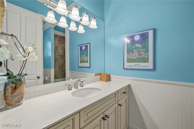 bathroom with vanity and a shower