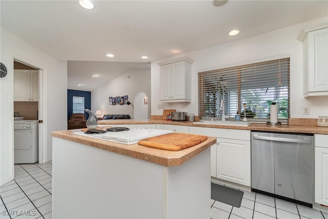 kitchen featuring light tile patterned flooring, sink, white cabinetry, dishwasher, and washer / clothes dryer