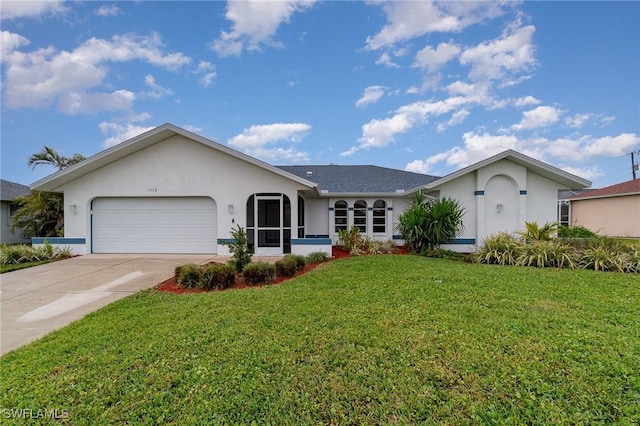 single story home featuring a garage and a front yard