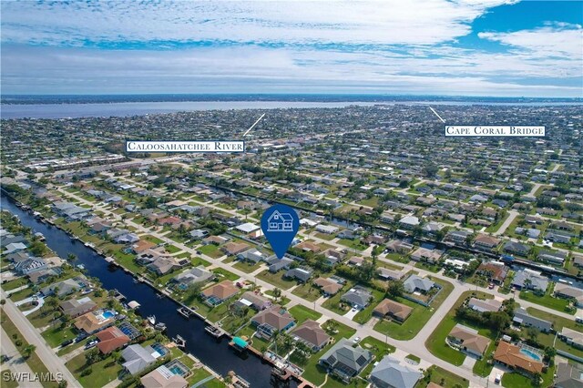 aerial view featuring a water view and a residential view