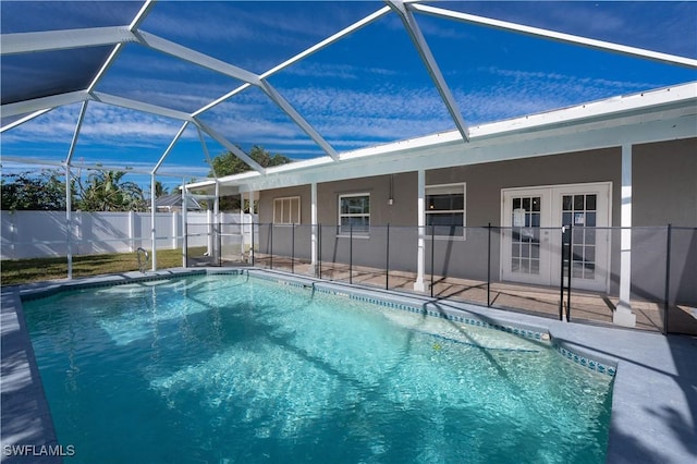 view of swimming pool featuring a fenced in pool, glass enclosure, a patio, and fence