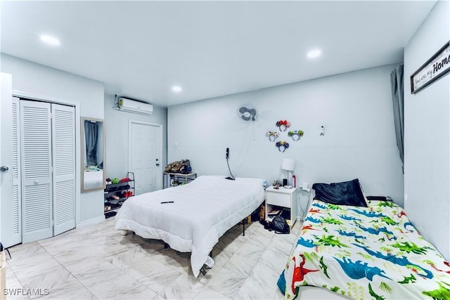 bedroom featuring a closet and an AC wall unit