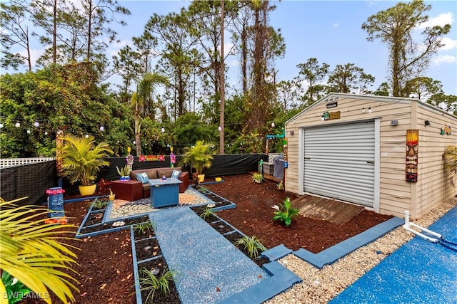 view of yard with an outdoor structure, outdoor lounge area, and a patio