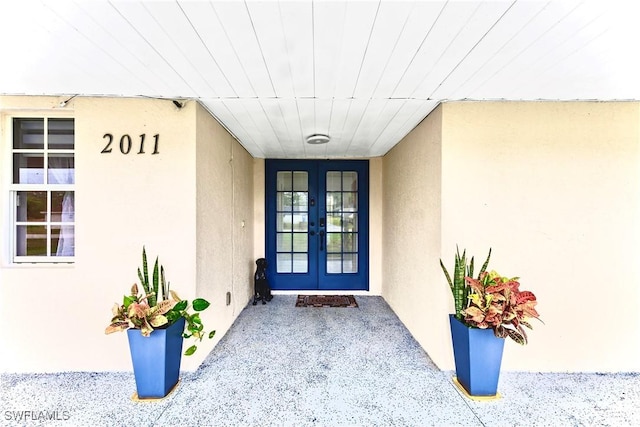 view of exterior entry featuring french doors