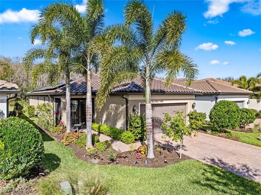 mediterranean / spanish-style house featuring a garage