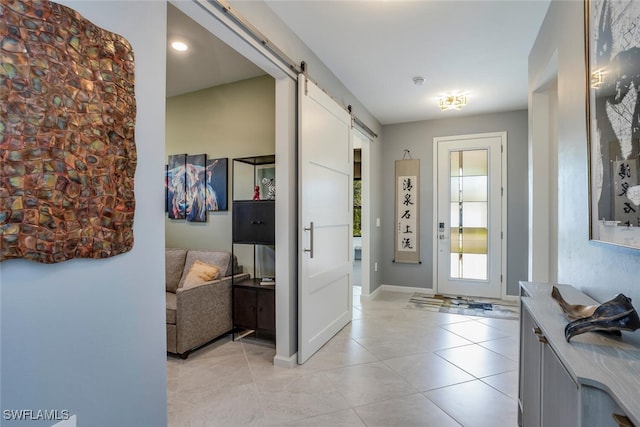 tiled entryway with a barn door