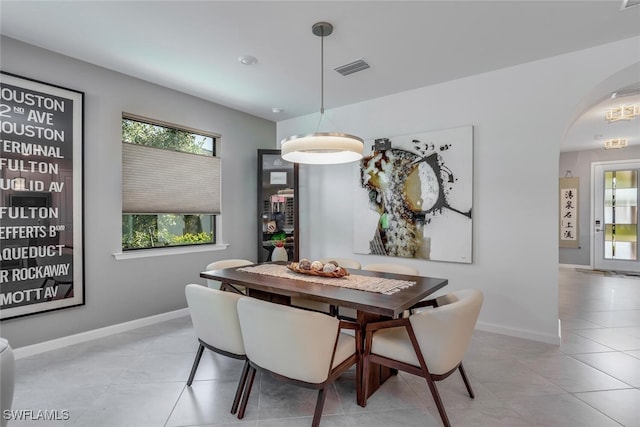 dining area with light tile patterned floors